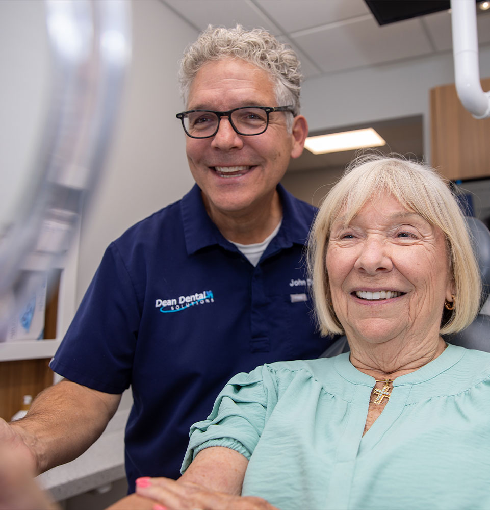 Paitent looking at brand new smile after dental crowns