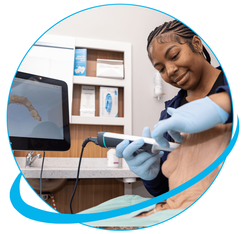 Team member taking a 3d scan of patients teeth